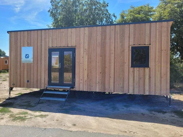 15.5 m² mobile multi-purpose living module with wood interiors and bathroom
